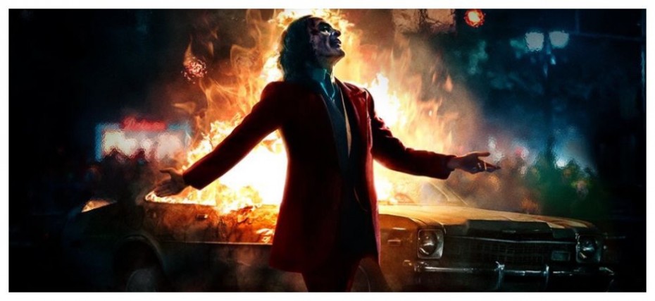 Joaquin Phoenix Laughs As The City Burns In New Joker Poster